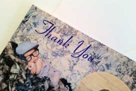cute baby on a suitcase on a thank you card