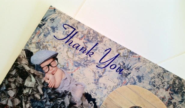 cute baby on a suitcase on a thank you card